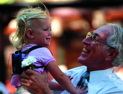 Pollyanna Begbie, a two year-old from England, who has a multiple-channel cochlear implant, communicating with Professor Graeme Clark in 2003. Photographer John Li from Eyecan Images., First printed in The Times (UK), 16 July 2003